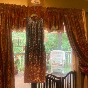 Sleeveless, knee length,l sequence navy blue ombre fades  to pink.